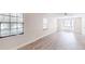 The living room has natural lighting from the windows and light wood flooring at 4121 Sw 6Th Ave, Ocala, FL 34471