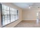 Bright living room features an abundance of natural light, ceiling fan, and vinyl plank flooring at 4121 Sw 6Th Ave, Ocala, FL 34471