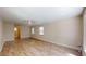 Bright open-plan living room with stylish vinyl floors, ceiling fan and large windows at 4121 Sw 6Th Ave, Ocala, FL 34471