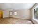 The living room is spacious and has a ceiling fan at 4121 Sw 6Th Ave, Ocala, FL 34471
