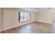 Bright living room with neutral walls, ceiling fan and sleek vinyl plank flooring at 4121 Sw 6Th Ave, Ocala, FL 34471