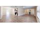 Bright open living area with vinyl floors connects dining, kitchen, and outdoor access at 4121 Sw 6Th Ave, Ocala, FL 34471