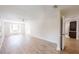 Inviting living room with vinyl plank flooring, ceiling fan, and a view to the kitchen at 4121 Sw 6Th Ave, Ocala, FL 34471