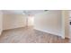 Open-concept living room showcasing neutral walls, modern ceiling fan, and wood-look flooring to complement any decor at 4121 Sw 6Th Ave, Ocala, FL 34471