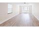 This expansive living room has three windows and natural light at 4121 Sw 6Th Ave, Ocala, FL 34471