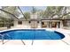 Enclosed pool area features a clean patio, with access to home and well-maintained pool for relaxation and fun at 4121 Sw 6Th Ave, Ocala, FL 34471