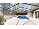 Inviting screened-in pool with ample deck space, perfect for entertaining and relaxing in a private outdoor oasis at 4121 Sw 6Th Ave, Ocala, FL 34471