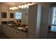 Bathroom boasting double sinks, cabinets, vanity, and a large mirror at 4501 Detour Rd, Haines City, FL 33844