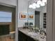 Bathroom features a granite countertop, ample storage, and decorative art at 4501 Detour Rd, Haines City, FL 33844