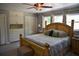 Bedroom featuring wood bedframe, ceiling fan, built in drawers, and natural light at 4501 Detour Rd, Haines City, FL 33844