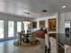 Bright dining area featuring a modern chandelier and stylish furniture with access to the outside at 4501 Detour Rd, Haines City, FL 33844