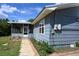 Exterior view of home featuring a porch and landscaping at 4501 Detour Rd, Haines City, FL 33844