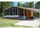 Close exterior view of outbuilding with screened porch and covered parking on right at 4501 Detour Rd, Haines City, FL 33844