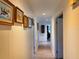 A hallway features picture frame molding and a series of framed art along the wall at 4501 Detour Rd, Haines City, FL 33844
