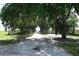 Scenic view of a private driveway lined with mature trees draped with Spanish moss at 4501 Detour Rd, Haines City, FL 33844