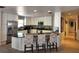 Modern kitchen boasts white cabinetry, stainless steel appliances, granite counters, and mosaic backsplash at 4501 Detour Rd, Haines City, FL 33844