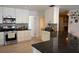 Modern kitchen with stainless steel appliances, granite counters, and convenient access to the dining area at 4501 Detour Rd, Haines City, FL 33844