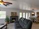 Spacious living room with fireplace, couch, and open to dining room at 4501 Detour Rd, Haines City, FL 33844