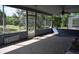 Enclosed patio area with seating and a view of the backyard at 4501 Detour Rd, Haines City, FL 33844