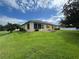 Spacious backyard featuring lush green grass, beautiful landscaping, and a partially fenced in area at 4622 Ne 15Th St, Ocala, FL 34470