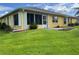 Expansive backyard with well-maintained landscaping, mature trees, and a patio area for outdoor living at 4622 Ne 15Th St, Ocala, FL 34470