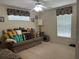 Comfortable bedroom featuring a cushioned sofa with patterned pillows and carpeted floor at 4622 Ne 15Th St, Ocala, FL 34470