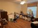 Functional bedroom with hardwood floors, natural light from the window, and plenty of space at 4622 Ne 15Th St, Ocala, FL 34470