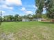 Large grassy yard with detached garage and privacy fence at 4660 Se 142Nd Ln, Summerfield, FL 34491