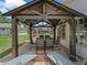 Covered patio seating area with outdoor dining furniture at 4660 Se 142Nd Ln, Summerfield, FL 34491