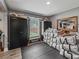 A gray storage room with black lockers and a small window at 4660 Se 142Nd Ln, Summerfield, FL 34491