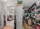 Spacious storage room featuring shelving and easy access to the home's interior at 4660 Se 142Nd Ln, Summerfield, FL 34491