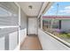 Inviting front porch featuring neutral tones, adding to the curb appeal of this home at 475 Ne 155Th Pl, Citra, FL 32113
