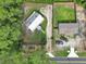 Aerial view of a property featuring mature trees, a home, and a shed at 5630 Se 183Rd Avenue Rd, Ocklawaha, FL 32179