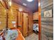 Rustic bathroom featuring wood walls, metal basin sink, and vintage decor at 5630 Se 183Rd Avenue Rd, Ocklawaha, FL 32179