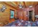 Cozy bedroom with wood paneling, natural light, and closet space at 5630 Se 183Rd Avenue Rd, Ocklawaha, FL 32179