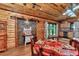 Dining area with rustic decor, wood-paneled walls, and natural light at 5630 Se 183Rd Avenue Rd, Ocklawaha, FL 32179