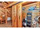 Hallway featuring wood paneling, sliding barn door, and shelving at 5630 Se 183Rd Avenue Rd, Ocklawaha, FL 32179