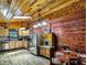 Charming rustic kitchen with wood walls, stainless steel appliances, and a breakfast nook at 5630 Se 183Rd Avenue Rd, Ocklawaha, FL 32179