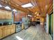 Open living space with wood-paneled walls, natural light, and a comfortable seating area at 5630 Se 183Rd Avenue Rd, Ocklawaha, FL 32179