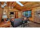 Cozy living room with wood walls, a skylight, comfortable seating, and stylish decor at 5630 Se 183Rd Avenue Rd, Ocklawaha, FL 32179