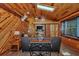 Inviting living room featuring warm wood finishes, ample natural light, and comfortable seating at 5630 Se 183Rd Avenue Rd, Ocklawaha, FL 32179
