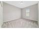 Cozy bedroom with neutral carpet, a window, and a closet at 6299 Sw 90Th St, Ocala, FL 34476