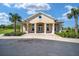 Community clubhouse featuring manicured landscaping, ample parking, and a welcoming entrance at 6299 Sw 90Th St, Ocala, FL 34476