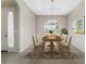 Dining room featuring natural light, trey ceiling, and stylish decor for elegant gatherings at 6299 Sw 90Th St, Ocala, FL 34476
