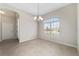 Empty dining room featuring modern tiled floor and natural light from a large window at 6299 Sw 90Th St, Ocala, FL 34476