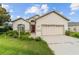 Charming single-story home with a two-car garage and a well-maintained front yard landscape at 6299 Sw 90Th St, Ocala, FL 34476