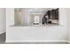 Kitchen bar features a view into the dining room with stylish gray and white countertops at 6299 Sw 90Th St, Ocala, FL 34476