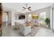 Bright living room featuring neutral decor, tile floors, and plenty of natural light at 6299 Sw 90Th St, Ocala, FL 34476