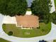 Birds-eye view of the home and lot showing the roof, driveway, mature trees, and location on a corner lot at 6551 Se 11Th Loop, Ocala, FL 34472