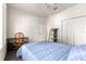 A cozy bedroom featuring a ceiling fan, an adjustable wooden desk chair, and ample natural light at 6551 Se 11Th Loop, Ocala, FL 34472